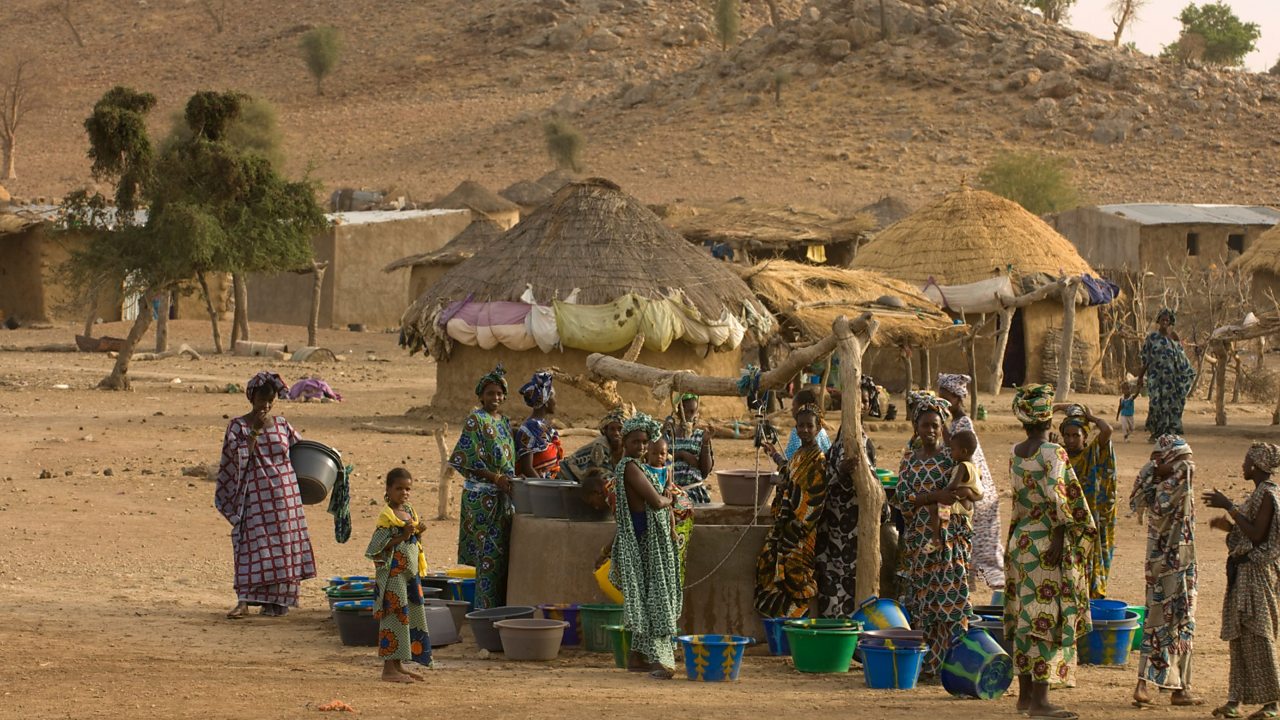 Women collecting water from a well in the Sahel region of the Senegal river