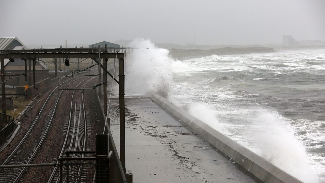 High winds blowing waves on to train tracks