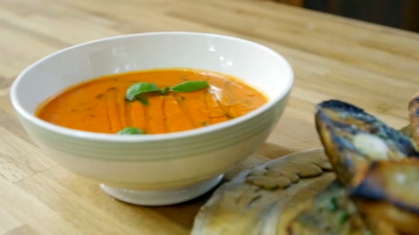 Tomato and basil soup with the best ever garlic bread recipe - BBC Food