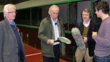 Chris, Des and Paul with Conor showing them a real tennis racket
