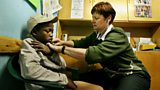 A street child receiving medical attention
