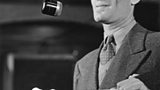 Bert Ambrose at the microphone in 1935