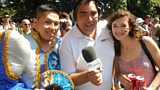 Martin Evans reporting live with people enjoying the carnival