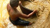 Washing gem gravel at a mine in Sri Lanka