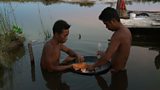 Miners use mechanical sluices to trap the mud that is rich in gold