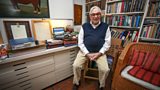 Ken Adam in his workroom (with James Bond archive files behind him)