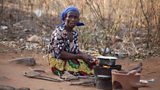 Woman using fuel efficient stoves
