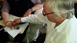 Leonard Plugge’s son Frank (right) shows his father’s medal, including his Legion d’Honneur, to presenter Dominic Sandbrook