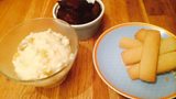 White Chocolate Rice Pudding with Spiced Biscuits and Raspberry Roast Plum Compote