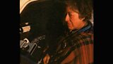 Ginette with typewriter. Sitting in her car at Orange Gate.