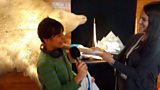 Eleanor is knighted with the penis bone of a walrus at The Royal and Ancient Polar Bear Society in Hammerfest, Norway