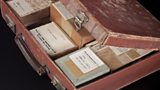 Leather attache case containing boxes of photographic glass plates