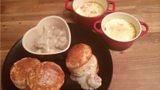 American Breakfast Biscuits with Sausage Gravy, accompanied by Baked Eggs and Ham
