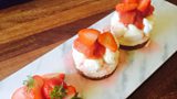 Mini White chocolate and orange cheesecakes with rhubarb and strawberry compote