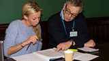 Nick, a PSU volunteer, helps Rachel prepare for her hearing