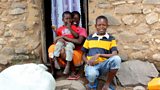 Elnest, his mum and his little brother