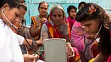 Two of Sambhavna Clinic’s team of community health workers out in the field