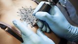 Should police officers be allowed on the beat with visible tattoos?