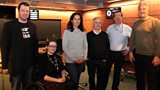 Presenter and guests in the studio