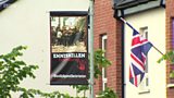 The PSNI say they won't remove controversial banners erected in a mixed housing estate in south Belfast