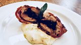 Black pudding stuffed chicken thighs wrapped in bacon with cheesy leeks