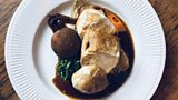 Chicken breast with Swiss rosti, savoy cabbage and a blue cheese stuffed date