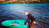 Alexander McCall Smith with boat