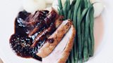 Duck breast with prunes sauce, silesian dumplings and green beans
