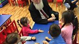 Methodist Minister Gabor Ivanyi in kindergarten he set up for poor children