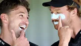 Two rugby players applying suncream during a training session in New Zealand (Credit: Getty Images)