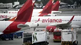 Airbus A320s lined up on the asphalt at an airport tarmac (Credit: Getty Images)