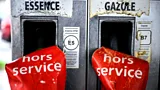 Two gas pumps with red signs covering them which read hors service (out of service) (Credit: Getty Images)