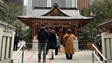 A group of people walk outside a shrine in Tokyo, Japan (Credit: Erika Ebsworth-Goold)