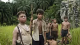 A still showing a group of boys in the jungle looking dishevelled taken from Lord of the Flies (Credit: Netflix)