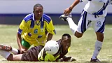 Barbados goalkeeper Horace Strout lies on the floor face first and watches the ball in a later game against Grenada in 2002 (Credit: Getty Images)