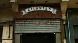 Graffiti covers the shutters of modern coffee shop Cilantro; a witness to the revolution and on-going protests in Egypt