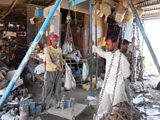 Waste pickers weighing scrap