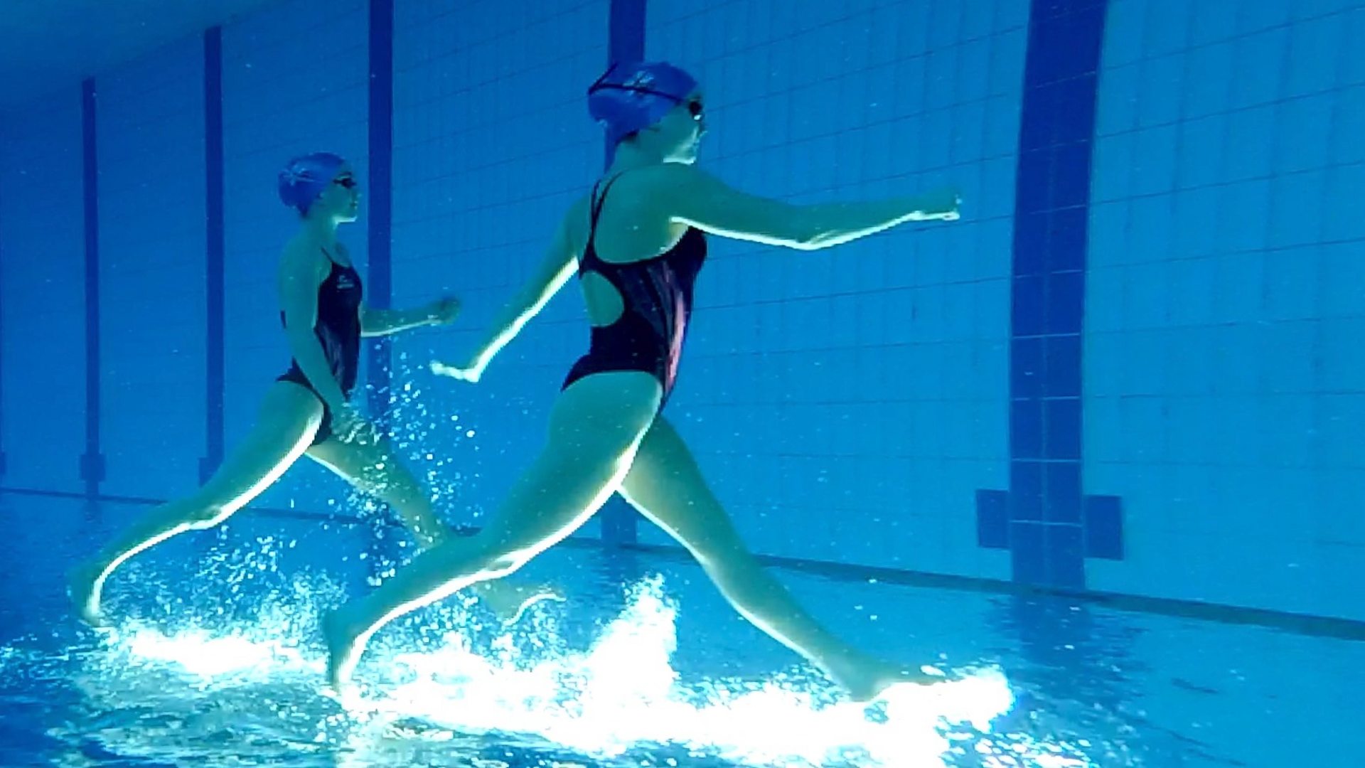 Synchronised swimmers 'dance in the water'