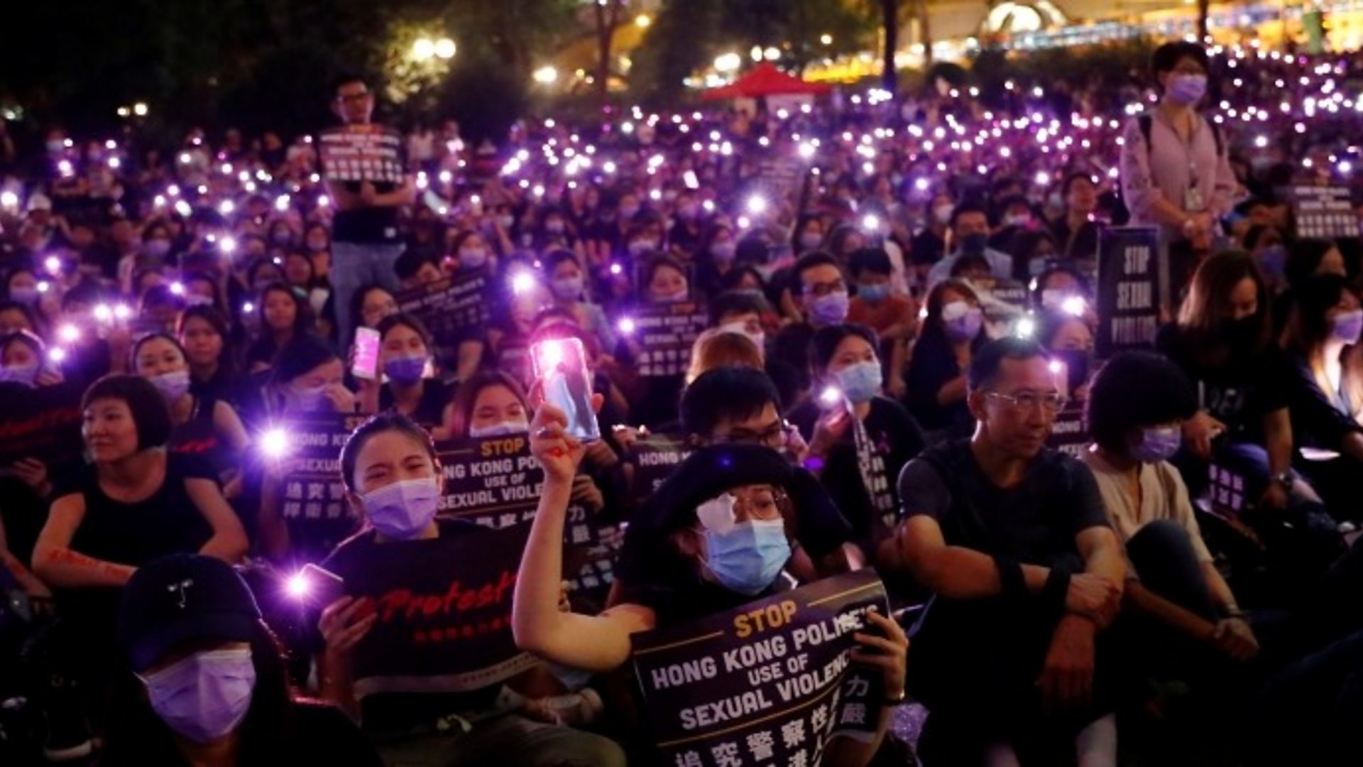 Hong Kong park lights up in sex abuse protest