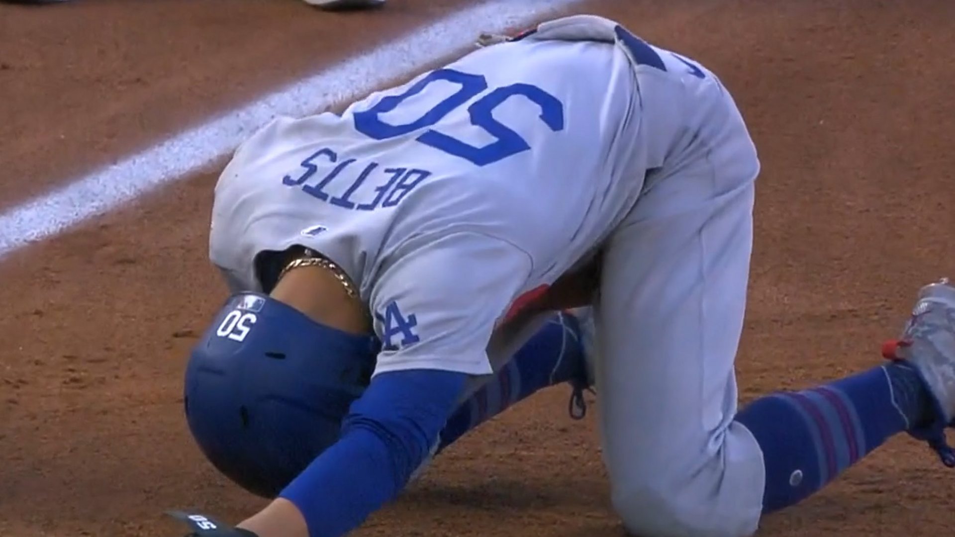 Los Angeles Dodgers' Mookie Betts taken down by accidental low blow - BBC  Sport