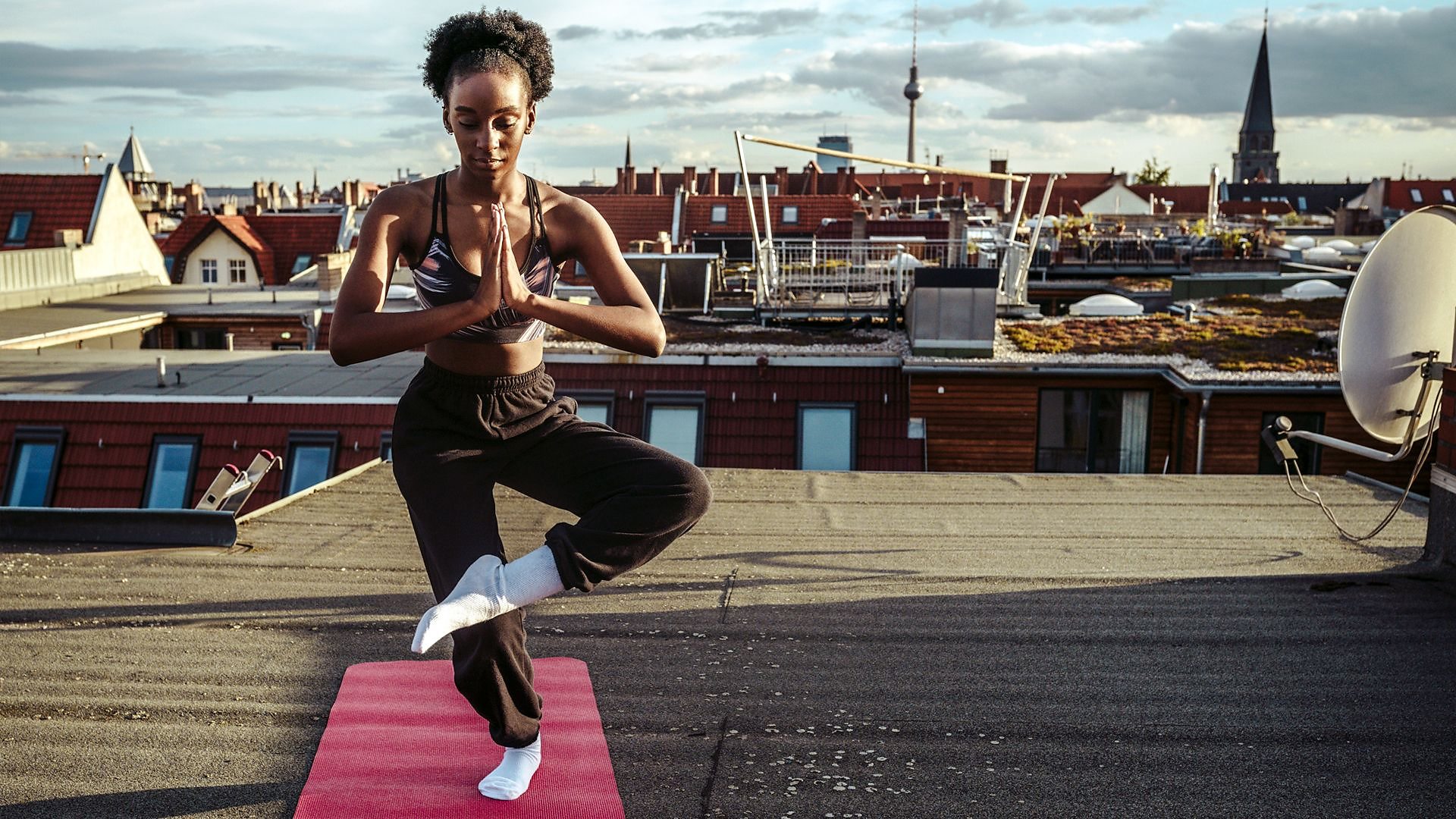 Yoga instructor standing one leg hi-res stock photography and