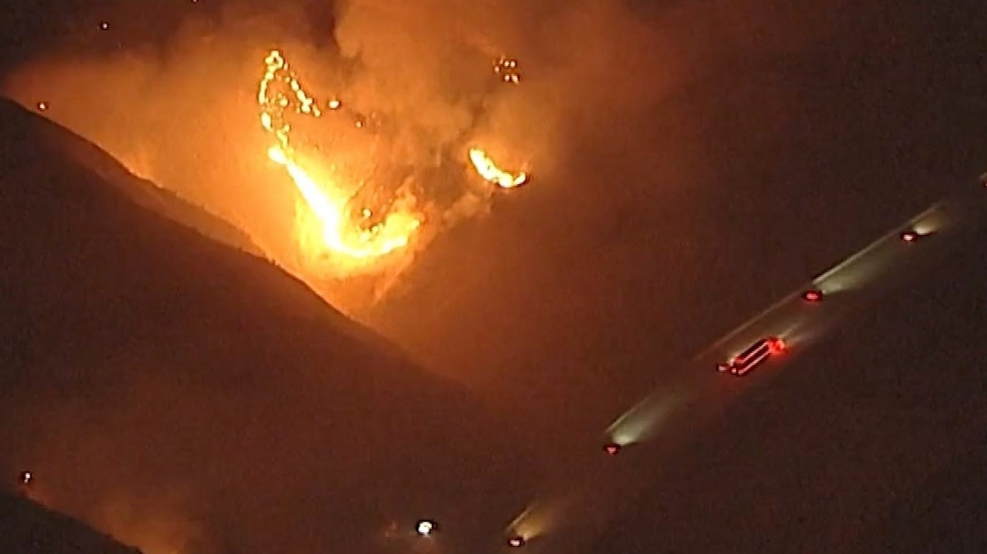 Watch: California wildfires rage near passing vehicles