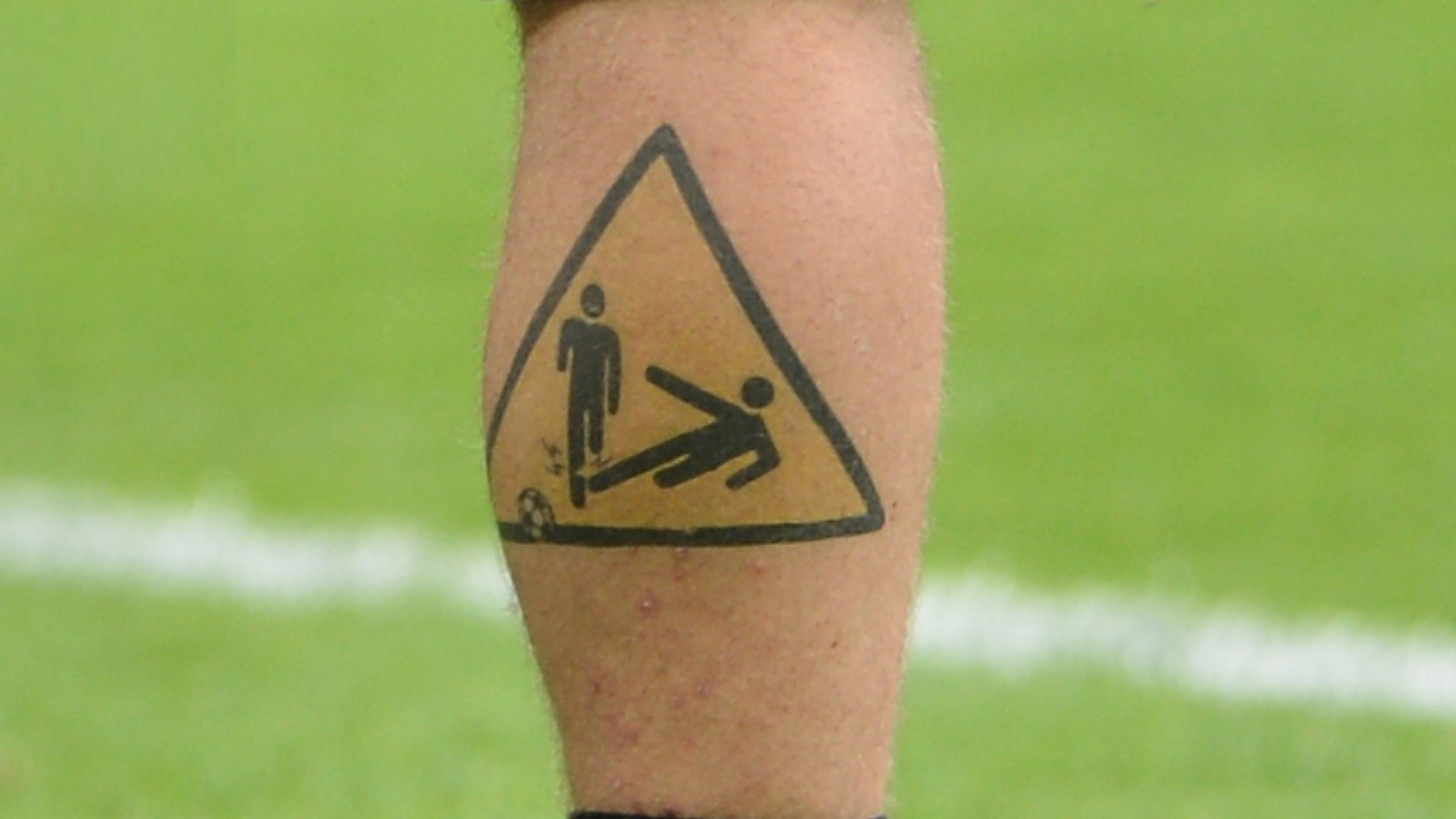 A tattoo on a footballer's leg