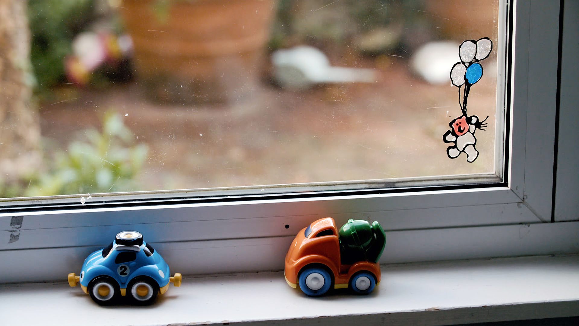 A child's toys on a window...