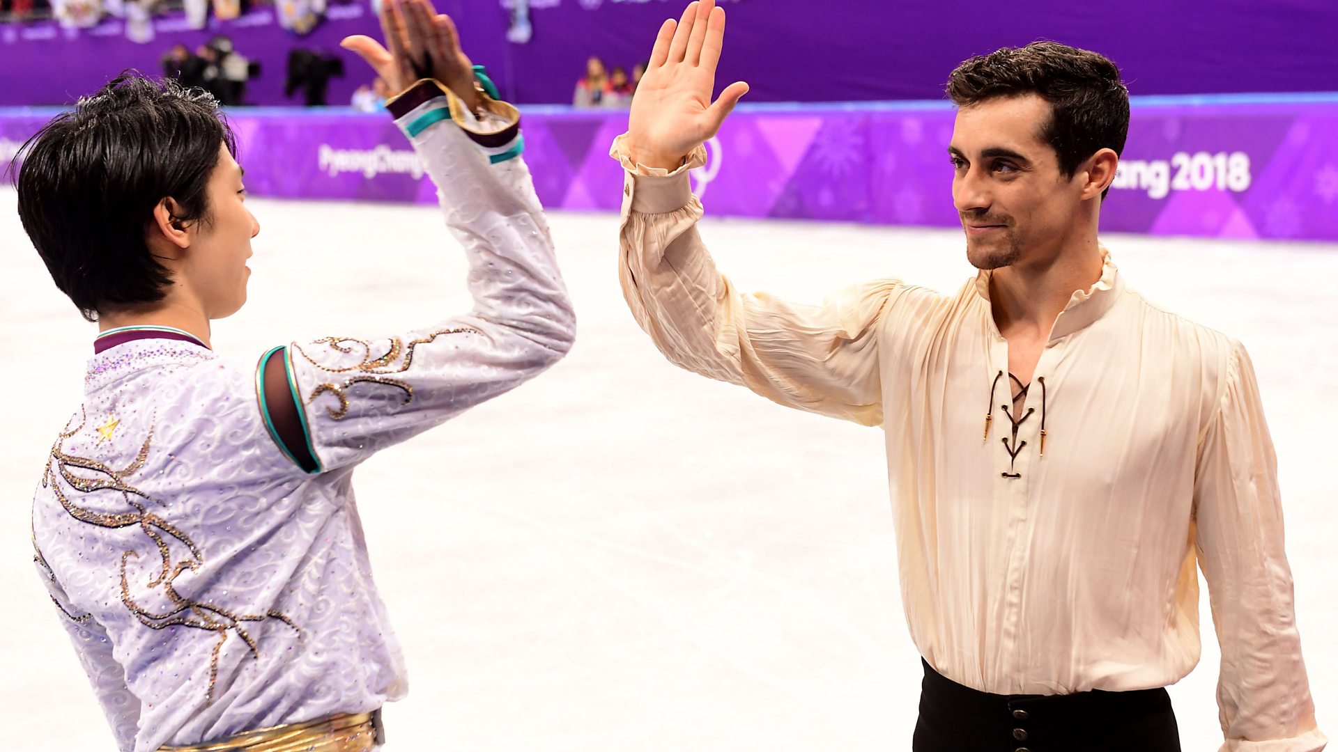 Yuzuru Hanyu and Javier Fernandez high-fiving