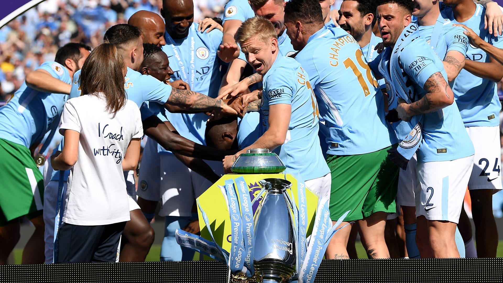 Manchester City knock Premier League trophy from plinth