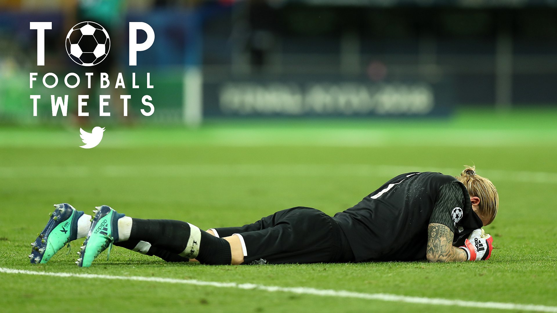 Livepool goalkeeper Karius lies, head in hands, on the pitch