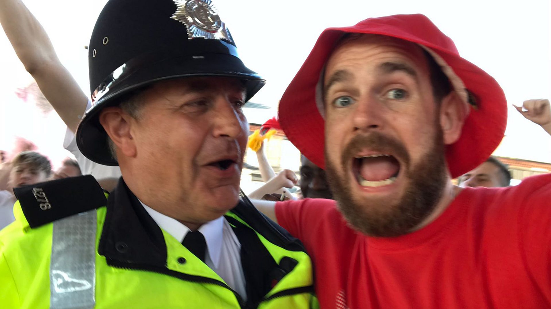 Fan with policeman