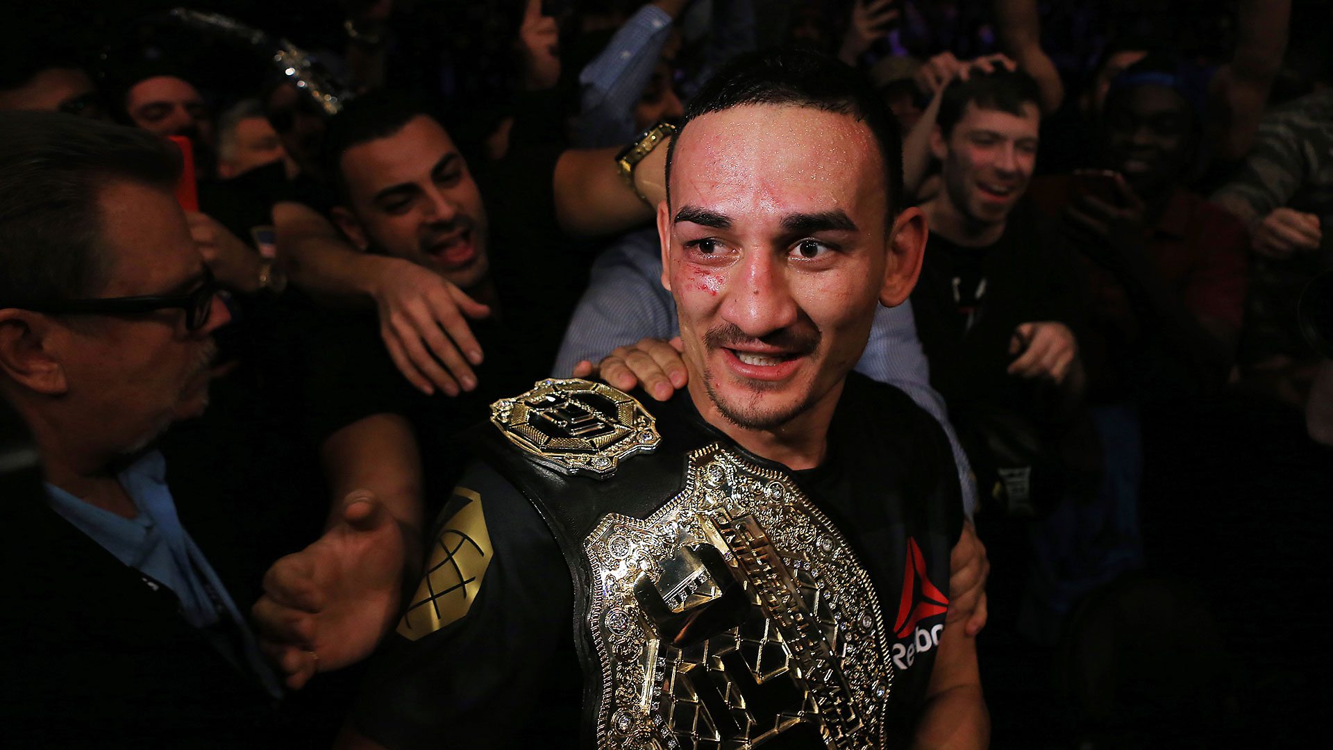 Max Holloway with the Interim Featherweight Title belt