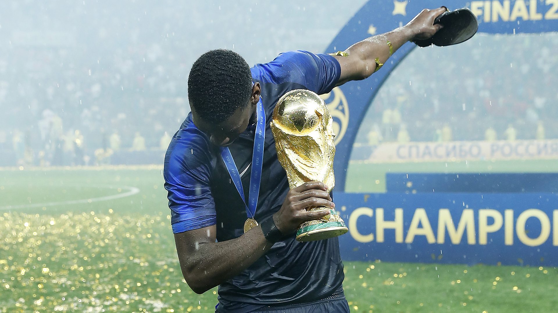 Paul Pogba dabs with the World Cup trophy